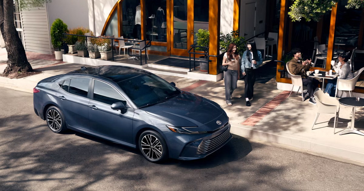 A 2026 Toyota Camry parked in front of a restaurant.