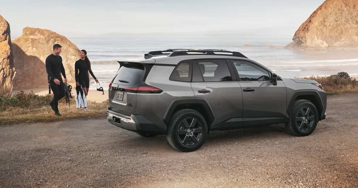 A grey 2026 Toyota RAV4 compact SUV parked by the ocean.